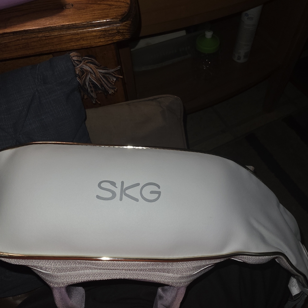 White & Rose Gold Electronic Massager - Compact Relief Device